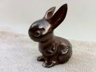 Small brass rabbit ornament.